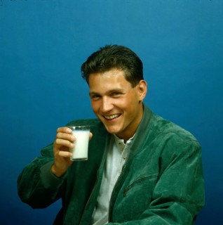 Young man with milk glass