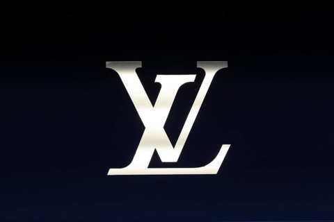 Close-up, logo of the French luxury fashion brand Louis Vuitton on a boutique in the shopping