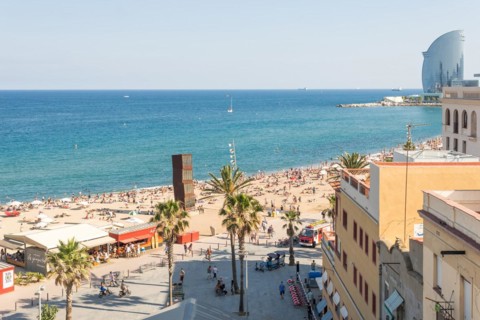 The beach and the promenade of Barceloneta. A nice part of Barcelona with lots of bars and