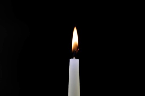 Close-up of a candle flame against a black background
