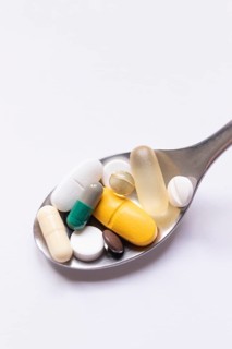 Symbolic image drug abuse, addiction, burnout, pharmacy, close-up of various pills and tablets on a