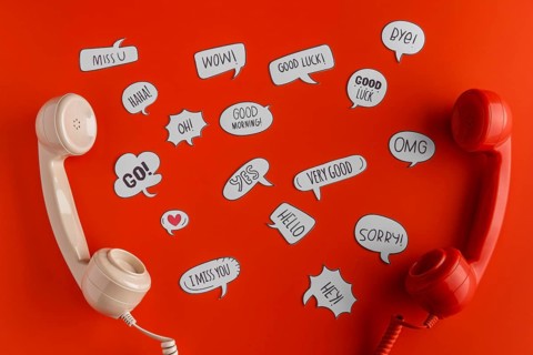 Top view selection chat bubbles with two telephone receivers