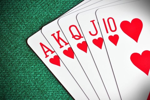 Royal Flush poker card sequence on a green table