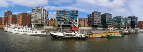 Panoramic photo of Sandtorhafen, traditional ship harbour and modern buildings in Hafencity,