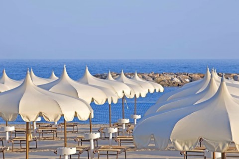 Parasols and beach chairs, beach, seaside resort of Arma di Taggia, province of Imperia, Liguria,