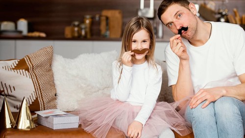 Front view smiley girl tutu skirt father with fake mustaches