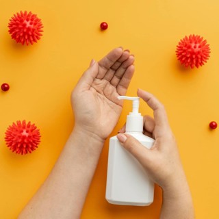 Flat lay hands using liquid soap with viruses