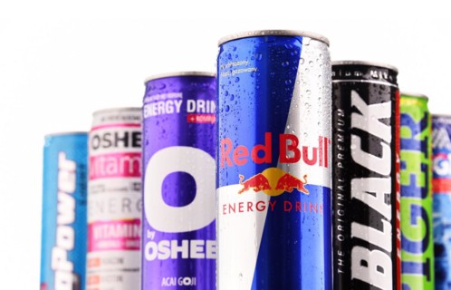 POZNAN, POLAND - JULY 27, 2017: Cans of popular global energy drinks, beverages containing