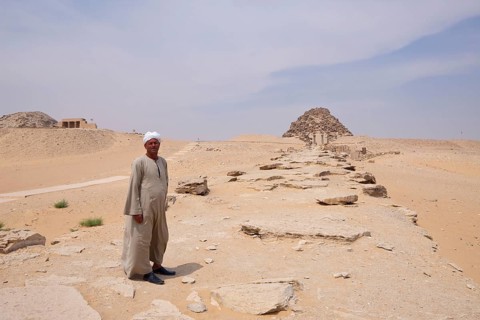 Man in front of funerary temple, pyramid of Pharaoh Sahure, Abusir, Egypt, Africa
