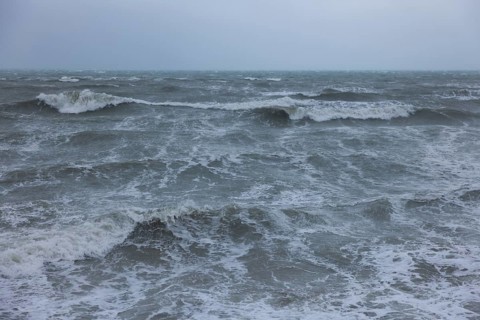 Stormy sea, foaming sea in storm with high waves on the English Channel, Portbail, Cotentin,