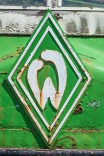 Werder bremen logo on the radiator grill of a vintage car, historic transporter for cooling fish in