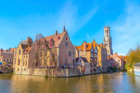 Bruges, Belgium iconic cityscape with medieval houses, tower Belfort and Rozenhoedkaai canal