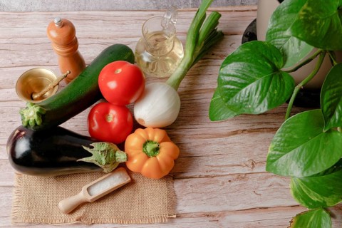 Top view of a group of fresh assorted vegetables to prepare a vegetarian menu, bell pepper, onion,