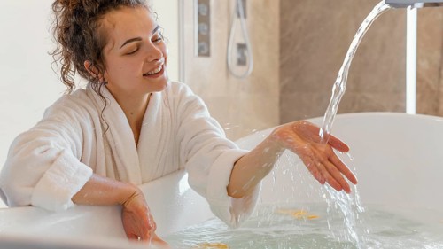 Woman bathrobe with hand water
