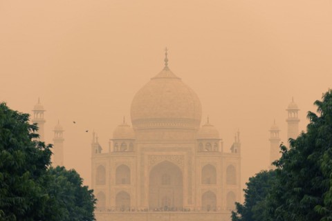The backside of the Taj Mahal in Agra, India on overcast day with smog