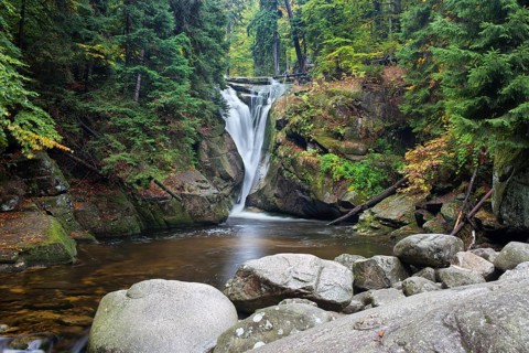 Szklarka waterfall (Polish: Wodospad Szklarki) in autumn forest, Karkonoski National Park,