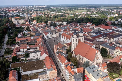 Drone shot, aerial view, drone photo, picture from above, historic town church St. Marien, view