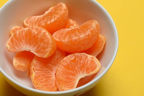 Clementine pieces in peel, citrus fruit
