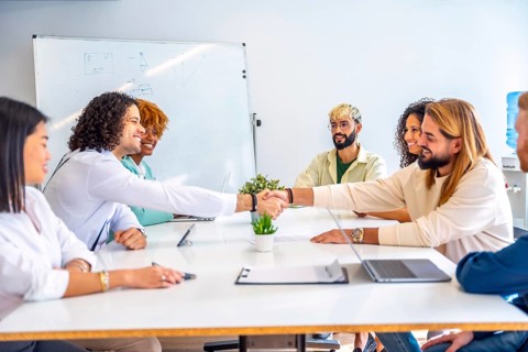 Men shaking hands during a meeting in a coworking