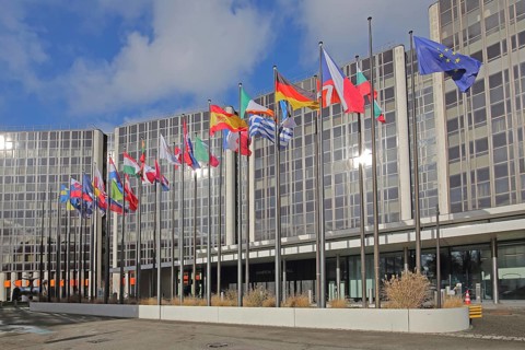 Modern building Winston Churchill with row of European national flags, state flag, European, EU
