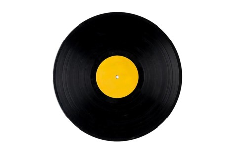 Black vinyl record with yellow label
