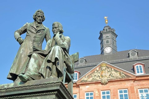Brothers Grimm national monument, standing Jacob and sitting on the chair Wilhelm and baroque
