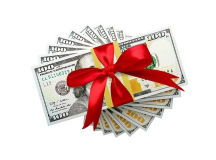 Overhead of one hundred thousand dollars spiralling stacks of one hundred dollar with red bow bills