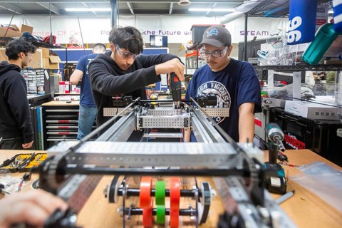 Detroit, Michigan - High school students build robots at the Detroit Hispanic Development Center's