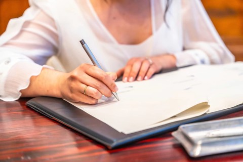 Signature of the bride after the wedding ceremony. Signature to consecrate the marriage at the