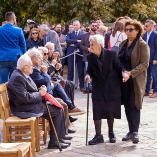 Survivors of the massacre of 3 June 1941, Elderly woman with walking aid at an outdoor gathering of