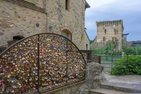 Love locks by an old mill wheel, Borghetto, Valeggio sul Mincio, Province of Verona, Italy, Europe