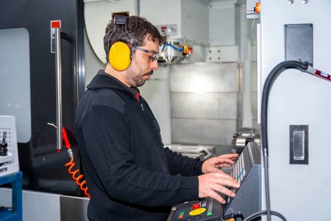 Factory worker who made the necessary coding in CNC modern machine