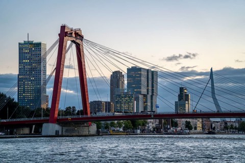 The skyline of Rotterdam, with the Willemsbrug and the Erasmus Bridge, behind, over the Nieuwe