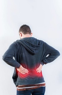 Male person with spine problems isolated. Back view of person with back ache isolated. Lumbar