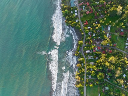 Top-down, aerial view, view of settlement and houses on the coast, Cahuita, Limón, Costa Rica,