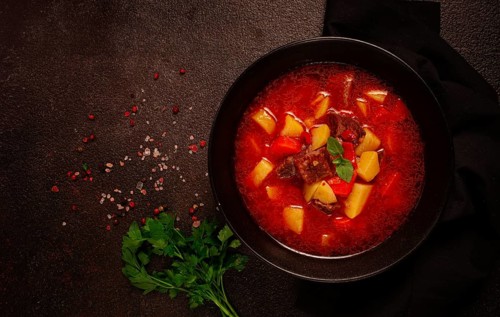 Meat goulash, with potatoes and carrots, sweet pepper, traditional Hungarian soup, homemade, no