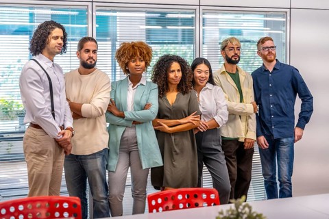 Portrait of a serious team of young and multiracial cowokers standing in the office