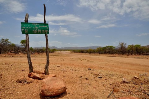 Sign at the entrance to the village of Omuramba, residential village of Chief Hikuminue Kapika, the