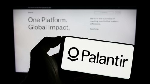 Stuttgart, Germany, 03-17-2023: Person holding cellphone with logo of US analytics company Palantir