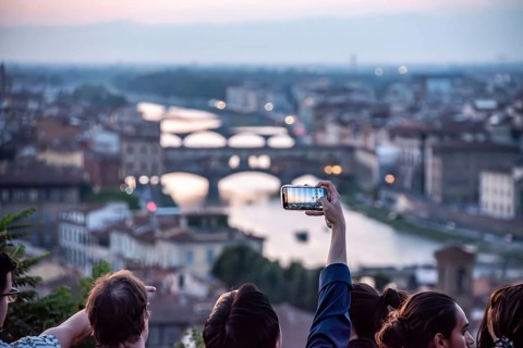 FLORENCE, ITALY, SEPTEMBER 21, 2023, Large tourist crowd on Piazzale Michelangelo enjoying sunset