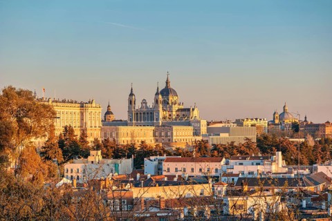 Madrid Spain, sunset city skyline at Cathedral de la Almudena with autumn foliage season