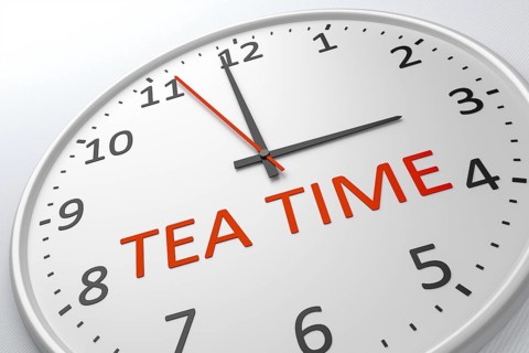 An image of a nice clock with the words tea time