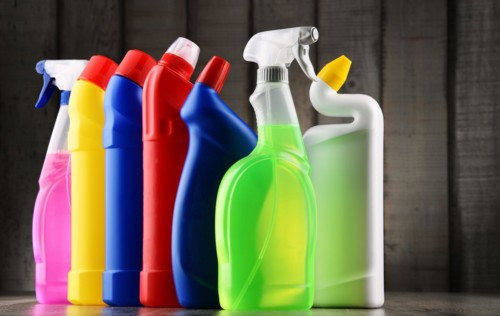 Variety of detergent bottles and chemical cleaning supplies
