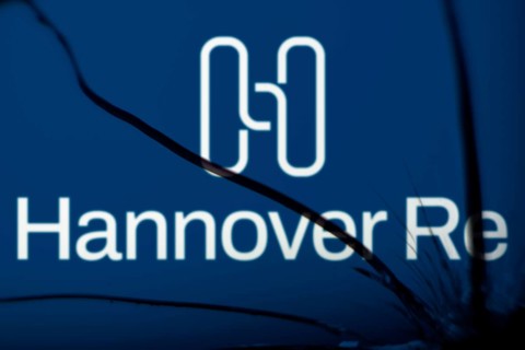 Hannover re logo is visible on the broken glass. Hannover Re is a reinsurance company