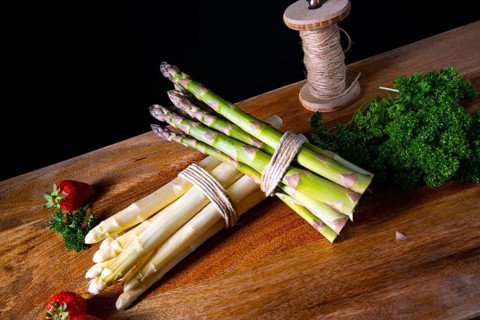 Green and white asparagus on the table