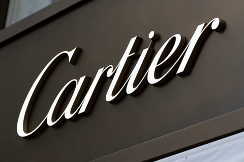 Close-up, logo of the French luxury fashion brand Cartier for jewellery and watches on a boutique