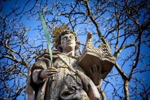 An angel in front of the abbey church St. Stephanus and St. Vitus, Abbey Castle Corvey in Hoexter,