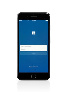 Apple iPhone 7 Plus with Facebook login screen on its display isolated on white background with