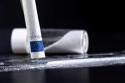 Cocaine Sniffing Closeup, Rolled Banknote for Snorting Line of Cocaine, Cocaine Drug Addiction