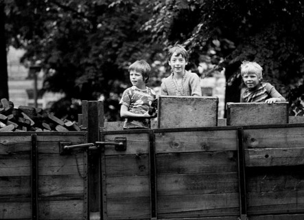 14/03/1982 GDR East Berlin district of Prenzlauer Berg. Three boys playing on a parked coal wagon